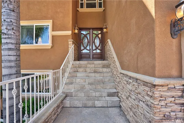 a view of an entryway with wooden floor