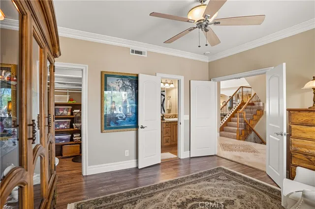 a living room with stainless steel appliances kitchen island granite countertop furniture and a view of kitchen