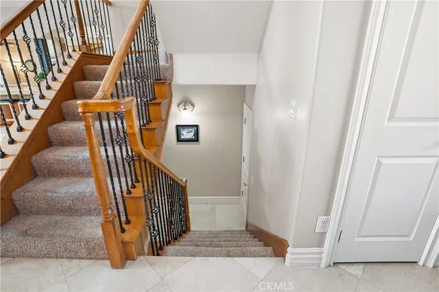 a large white kitchen with a large window