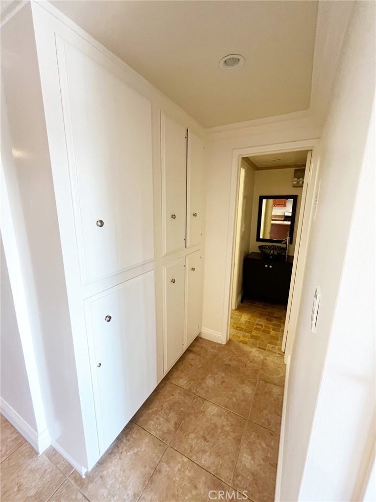 100 Cliff Drive, Unit 8 Laguna Beach, CA 92651 - Photo 12 of 46 a view of a hallway with wooden floor
