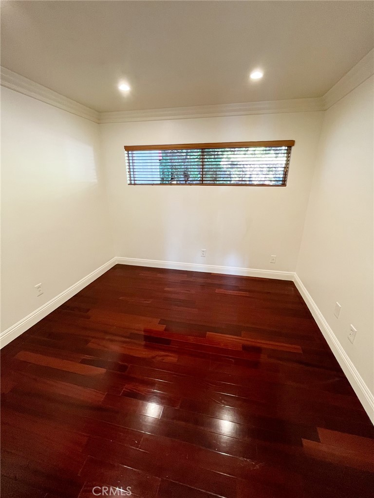100 Cliff Drive, Unit 8 Laguna Beach, CA 92651 - Photo 16 of 46 a view of empty room with wooden floor