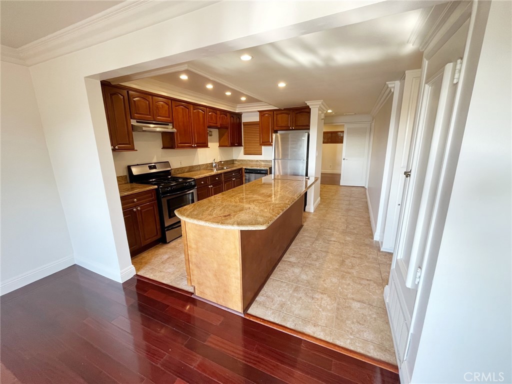 100 Cliff Drive, Unit 8 Laguna Beach, CA 92651 - Photo 5 of 46 a living room with stainless steel appliances granite countertop furniture wooden floor and a view of kitchen