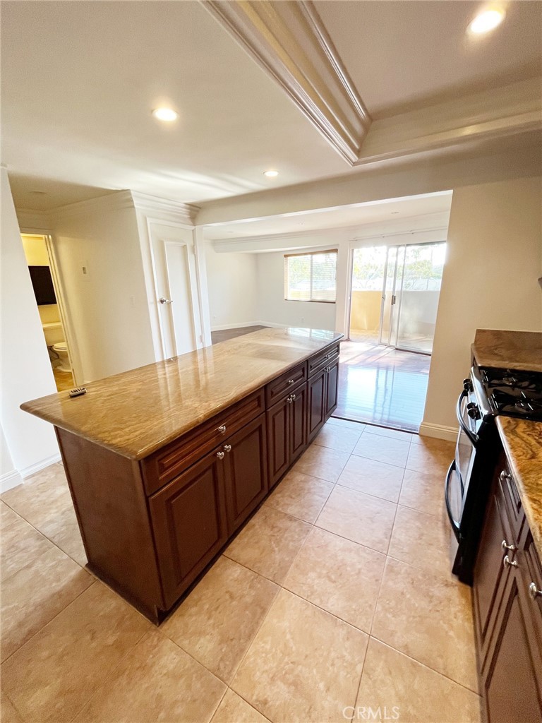 100 Cliff Drive, Unit 8 Laguna Beach, CA 92651 - Photo 8 of 46 a kitchen with stainless steel appliances granite countertop a stove a sink and a refrigerator