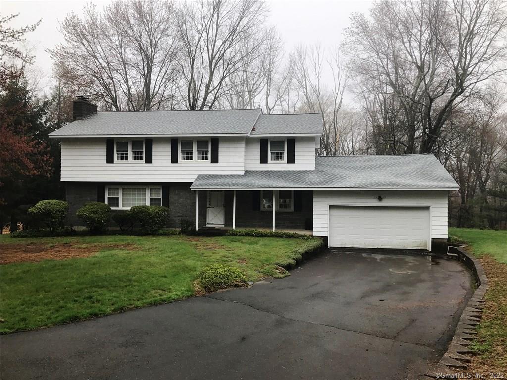25 Bethridge Road Bethany, CT 06524 - Photo 1 of 1 a front view of a house with a garden and yard