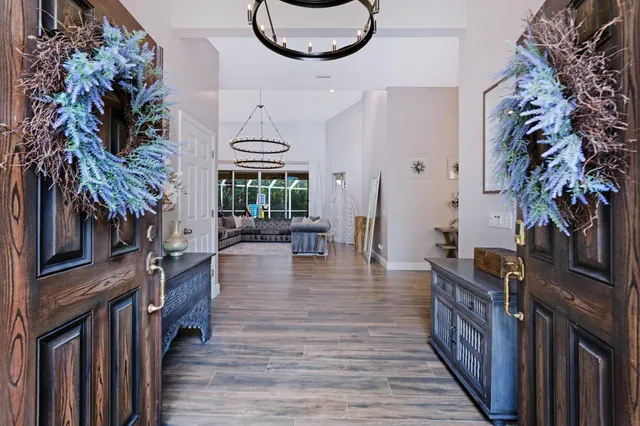 a spacious bathroom with a granite countertop sink a toilet and bathtub