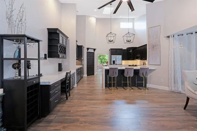 a bedroom with bed and wooden floor