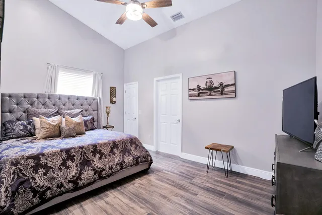 a bedroom with a bed and a window