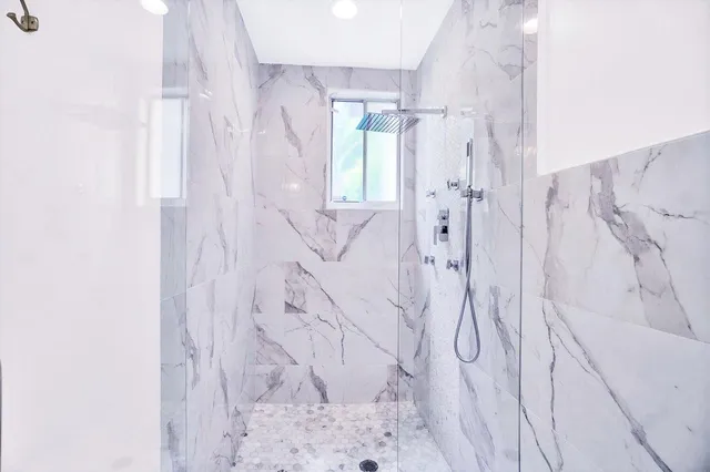 a bedroom with a bed and a television