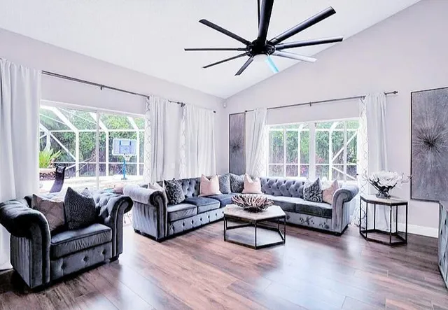 a living room with furniture and a flat screen tv