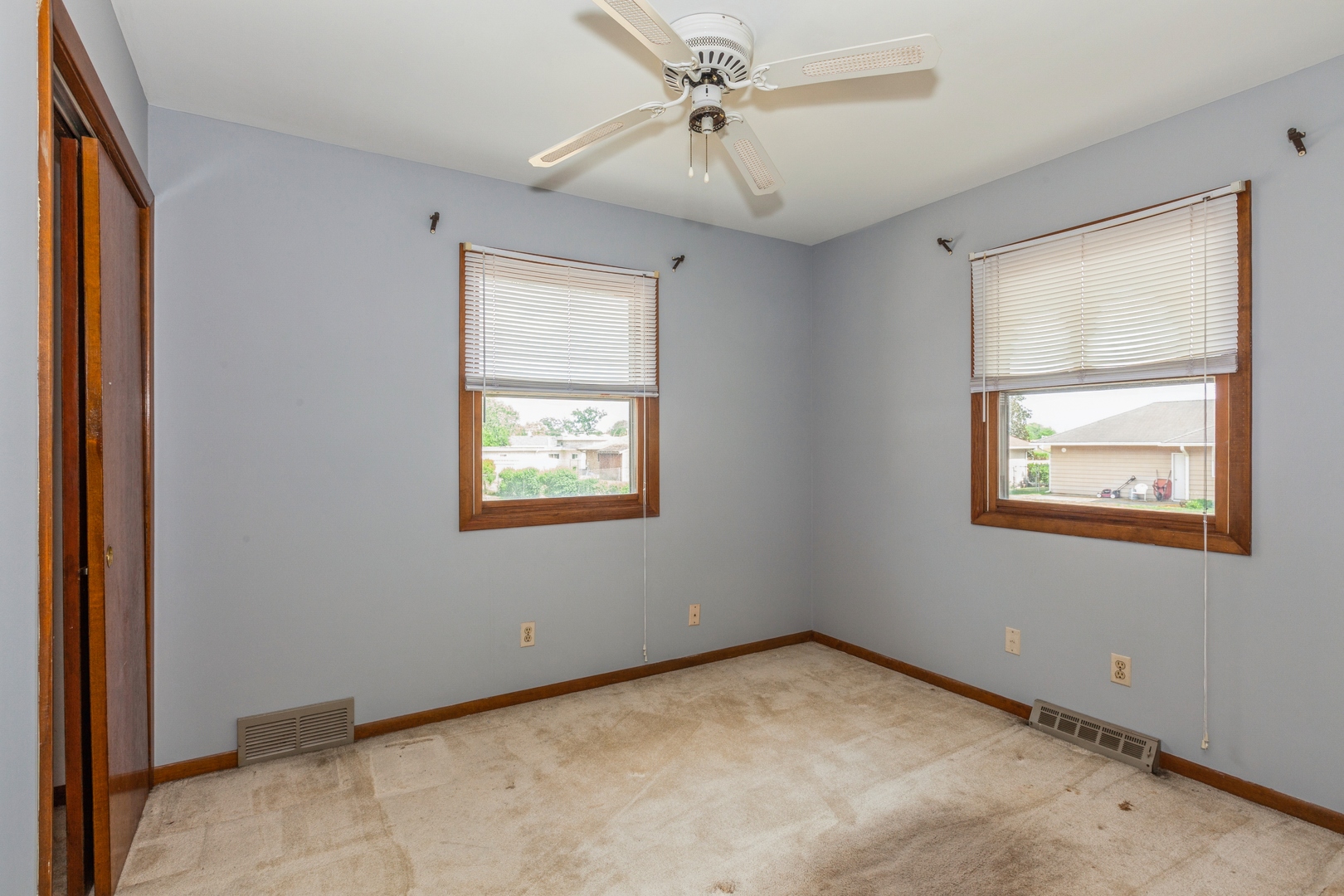 1205 Comet Drive Aurora, IL 60505 - Photo 11 of 15 an empty room with windows and fan