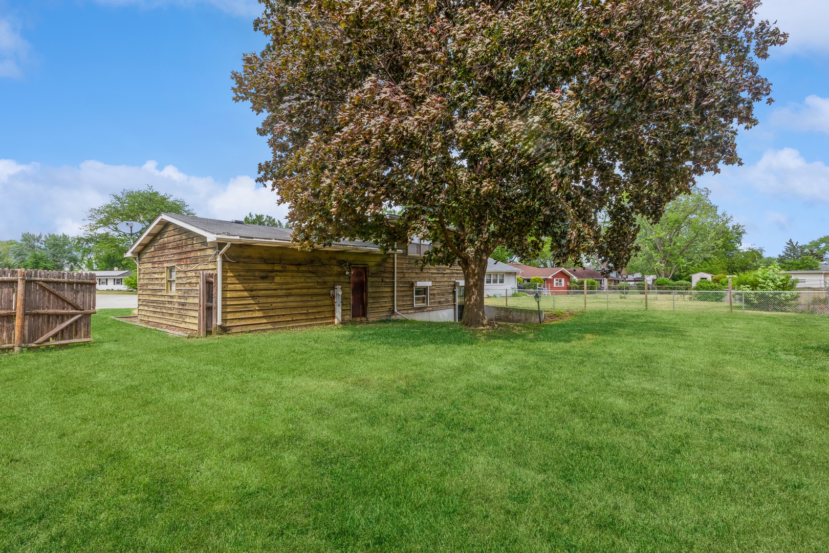 1205 Comet Drive Aurora, IL 60505 - Photo 13 of 15 a view of a house with a backyard