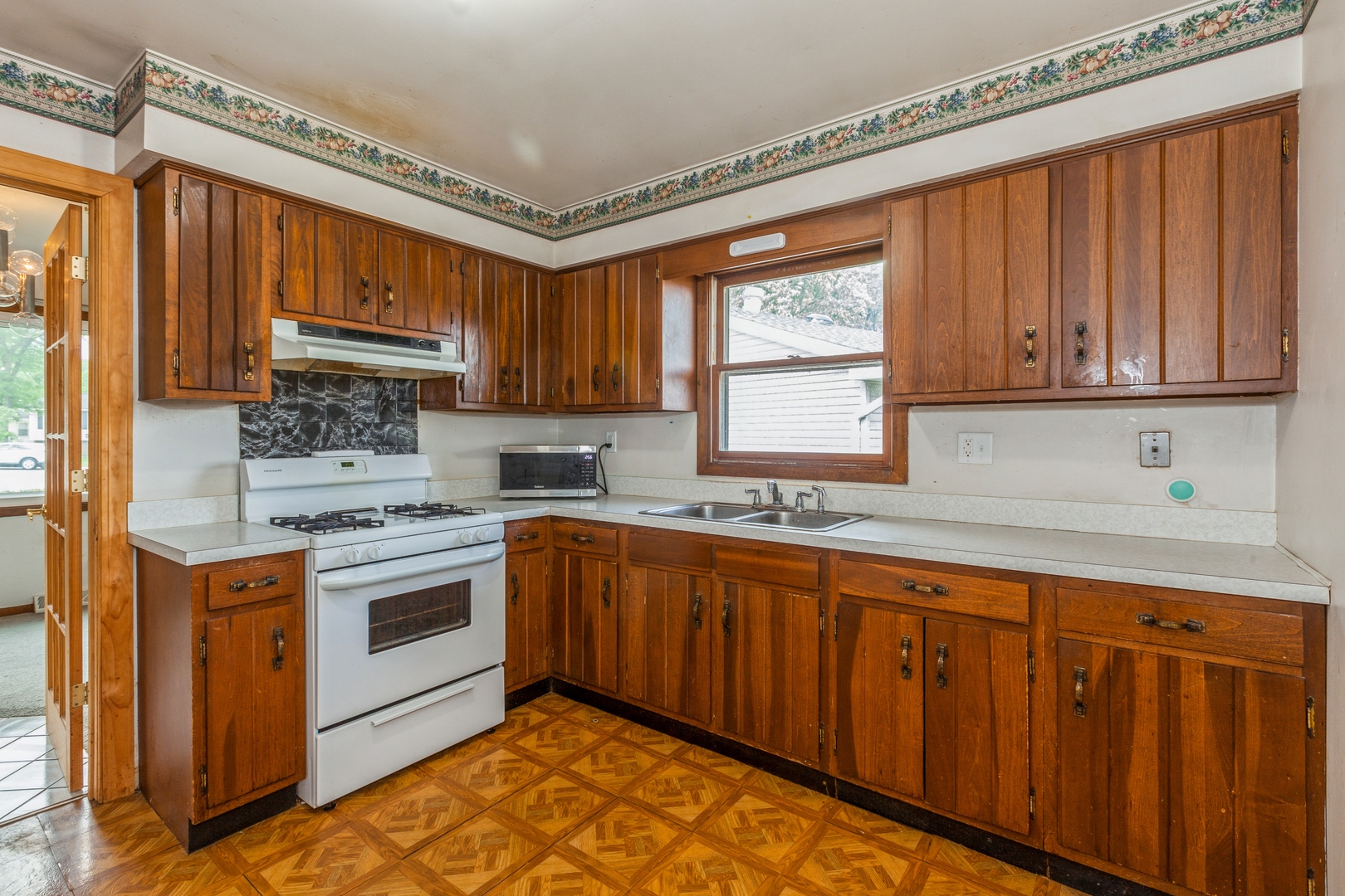 1205 Comet Drive Aurora, IL 60505 - Photo 4 of 15 a kitchen with stainless steel appliances granite countertop a stove a sink dishwasher and a refrigerator