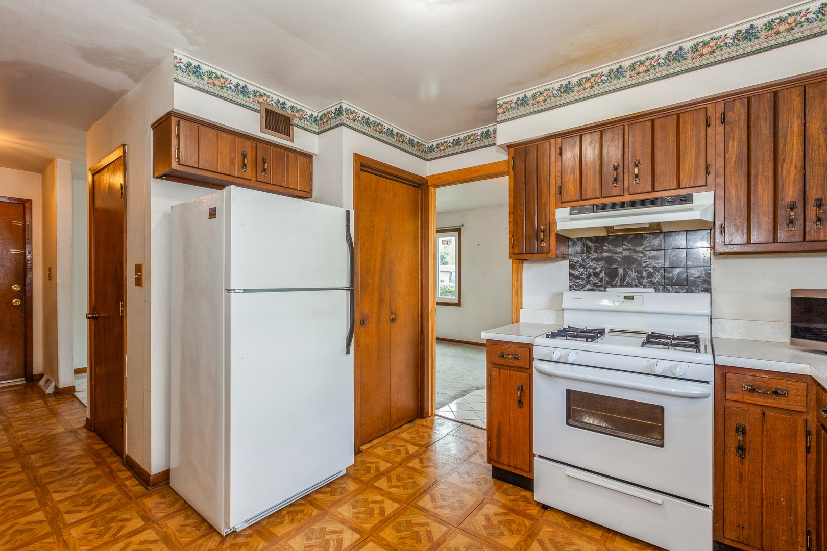 1205 Comet Drive Aurora, IL 60505 - Photo 5 of 15 a kitchen with stainless steel appliances granite countertop a refrigerator and a stove top oven