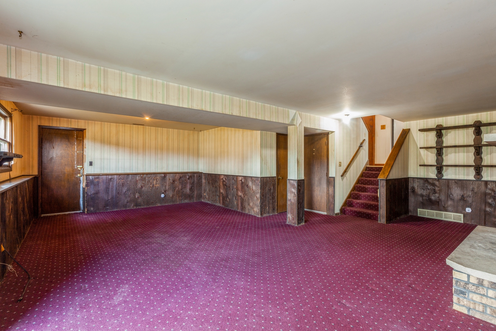 1205 Comet Drive Aurora, IL 60505 - Photo 7 of 15 a view of an empty room with stairs and a living room