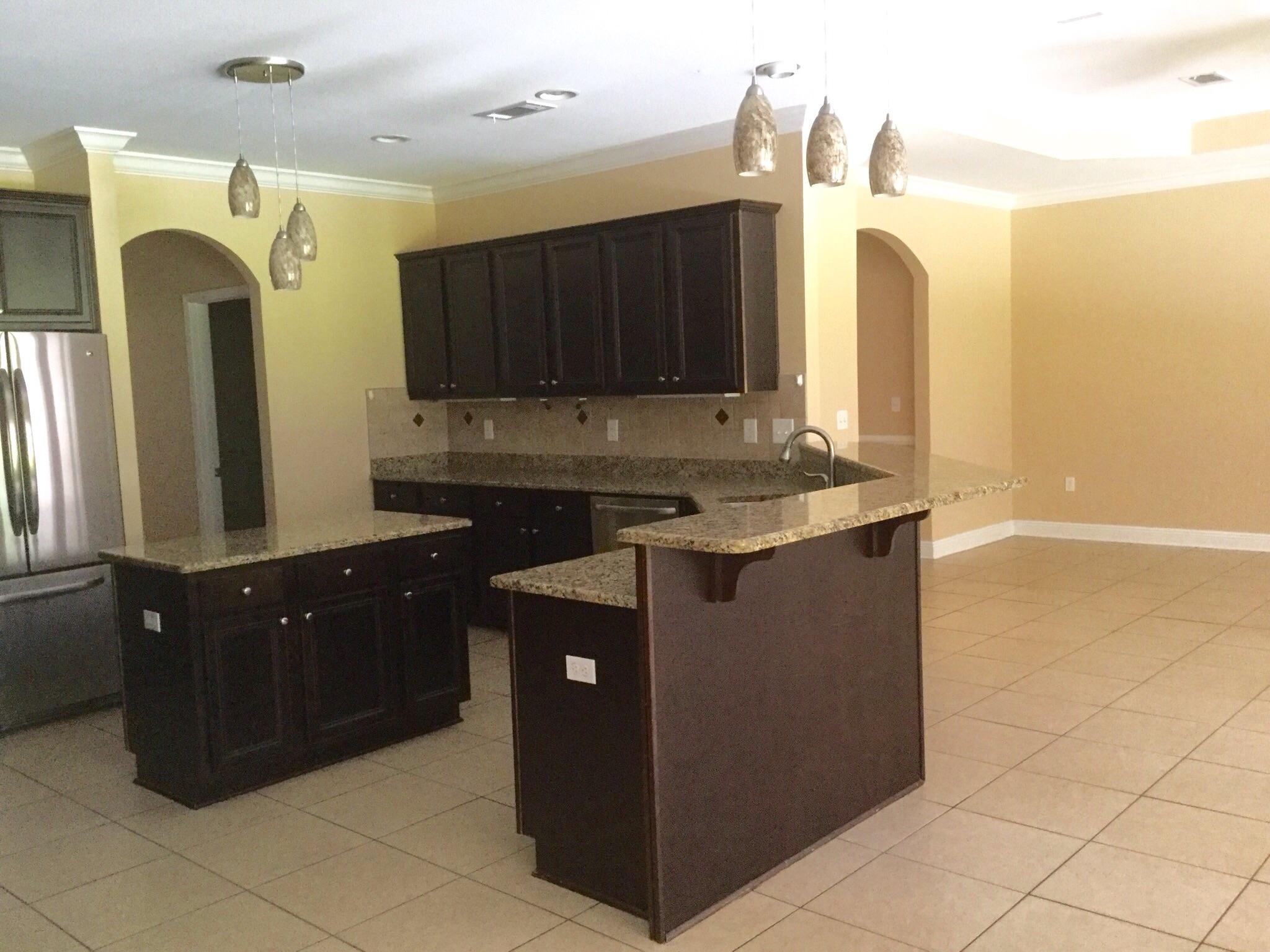 630 Red Fern Road Crestview, FL 32536 - Photo 19 of 38 a kitchen with a sink and a cabinets