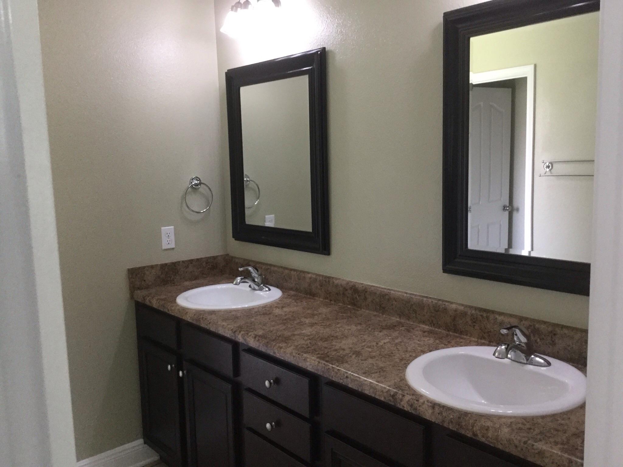 630 Red Fern Road Crestview, FL 32536 - Photo 25 of 38 a bathroom with a granite countertop sink and a mirror