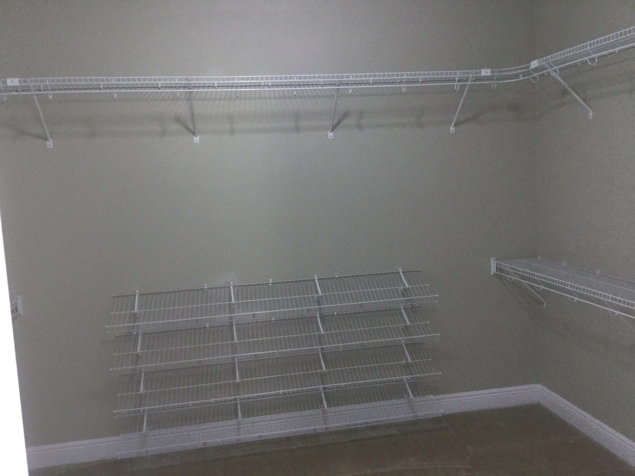 630 Red Fern Road Crestview, FL 32536 - Photo 27 of 38 a view of a room with racks on the wall
