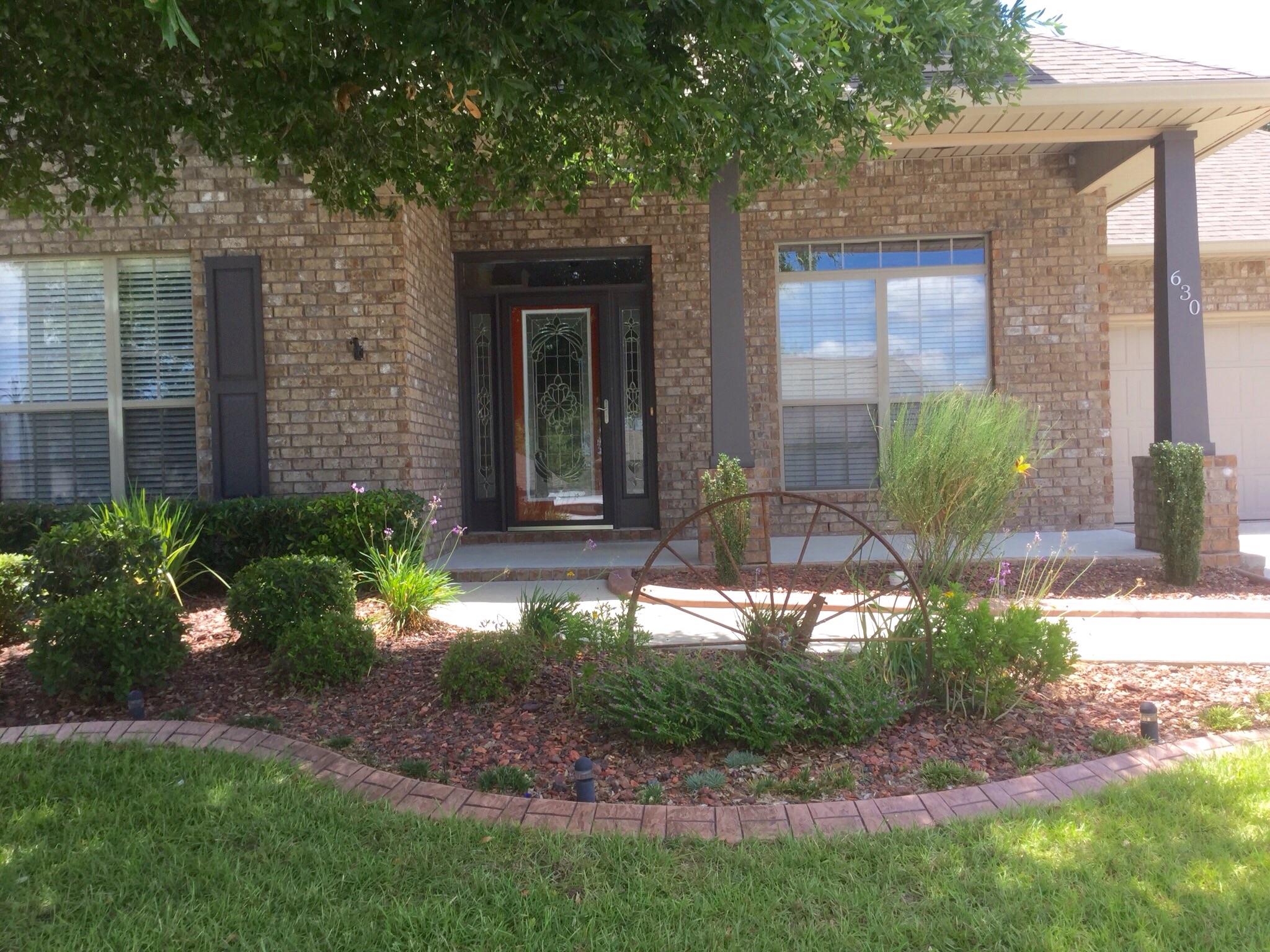 630 Red Fern Road Crestview, FL 32536 - Photo 6 of 38 a front view of a house with garden