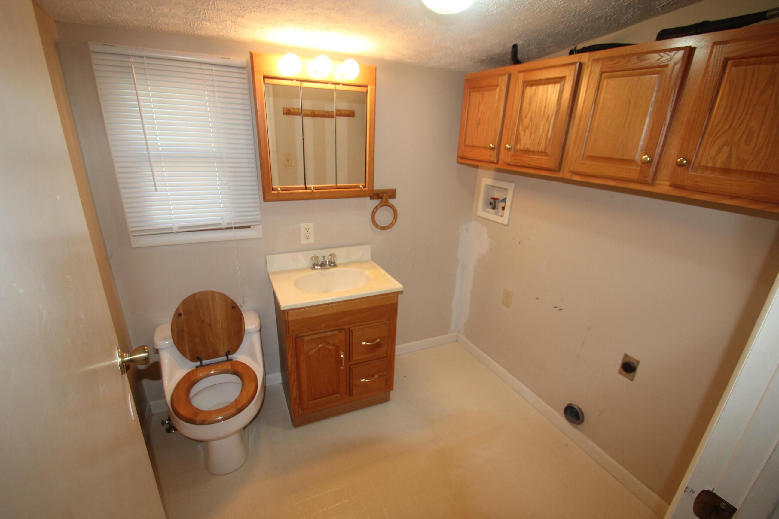 540 Newmans-Cardington Road West Prospect, OH 43342 - Photo 27 of 41 Half bath with laundry room.