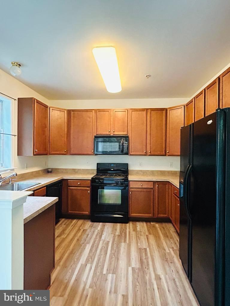 1028 Timberlake Drive Ewing, NJ 08618 - Photo 2 of 11 a kitchen with granite countertop a refrigerator stove top oven and sink