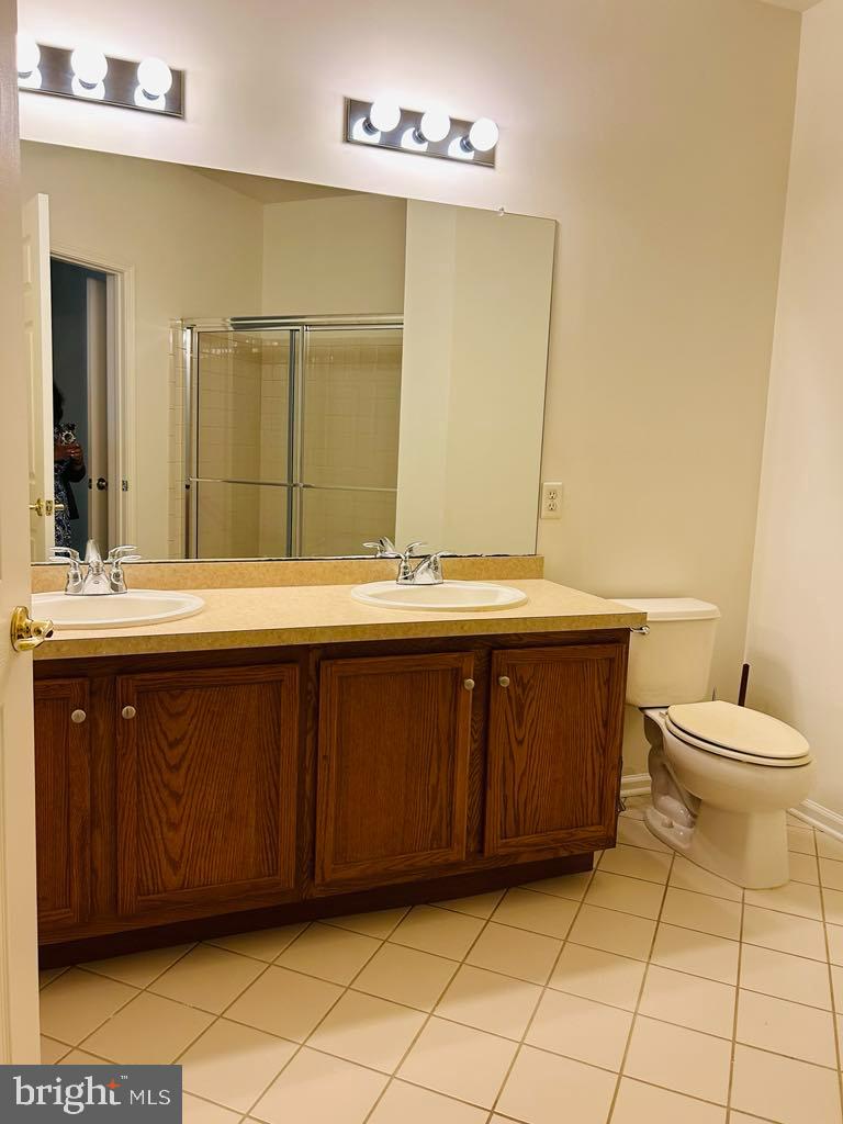 1028 Timberlake Drive Ewing, NJ 08618 - Photo 5 of 11 a bathroom with a granite countertop sink and a toilet
