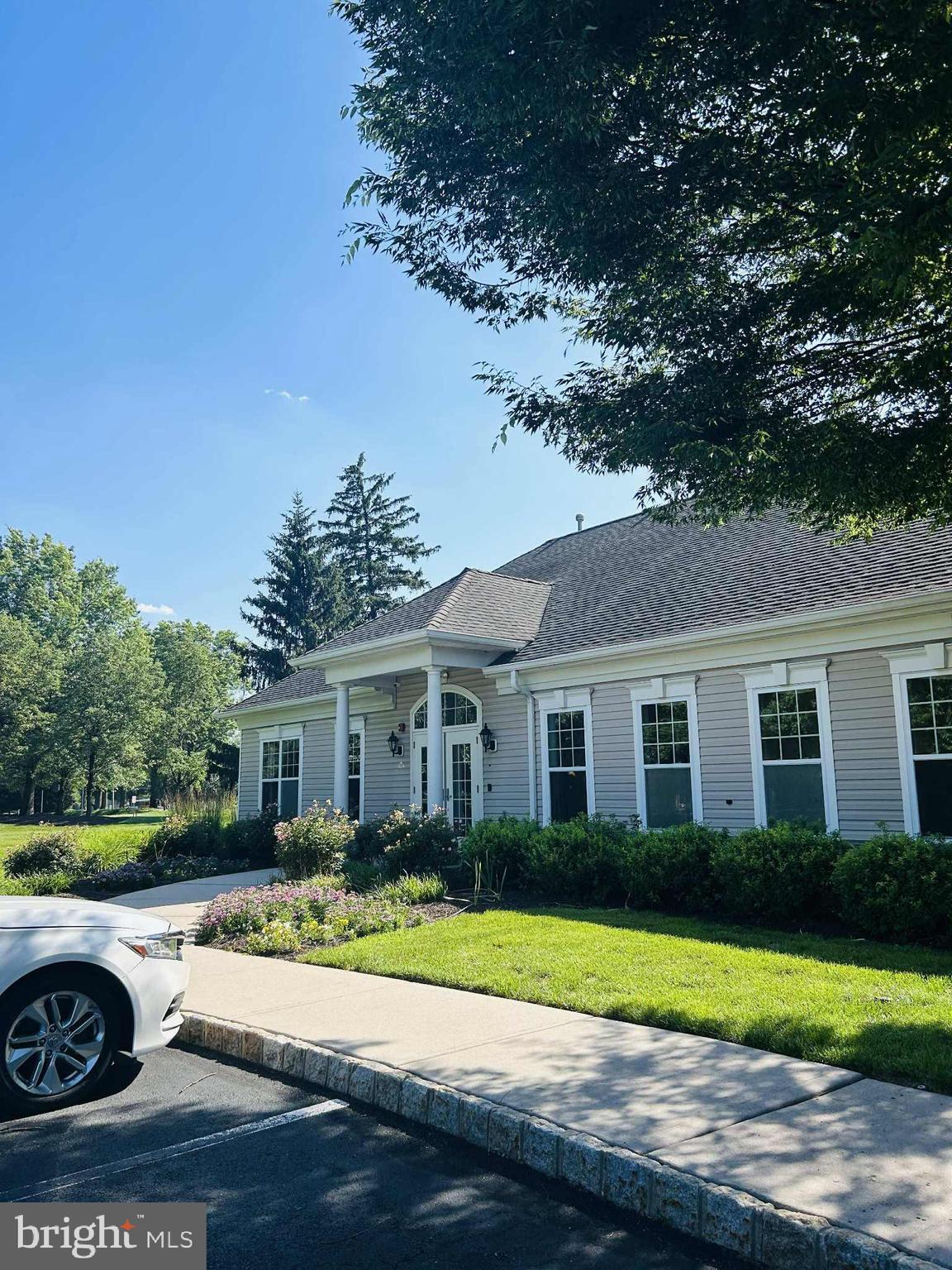 1028 Timberlake Drive Ewing, NJ 08618 - Photo 10 of 11 a front view of a house with a yard and garage