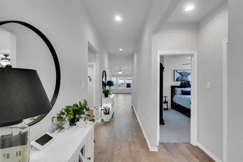 an entryway with a dining room and livingroom view
