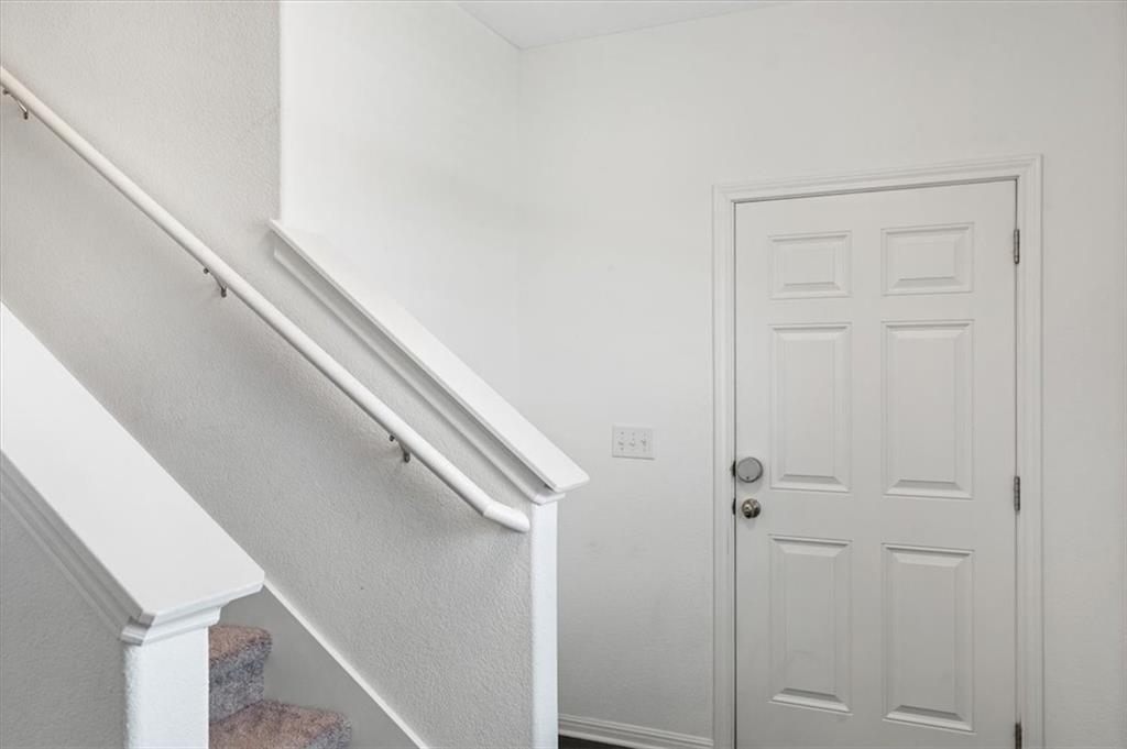 6500 Routenburn Street Austin, TX 78754 - Photo 16 of 38 Stairway with baseboards