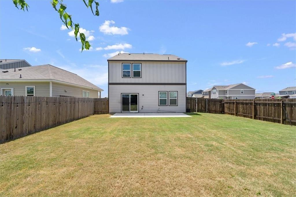 6500 Routenburn Street Austin, TX 78754 - Photo 34 of 38 Rear view of house with a patio, a fenced backyard, and a residential view
