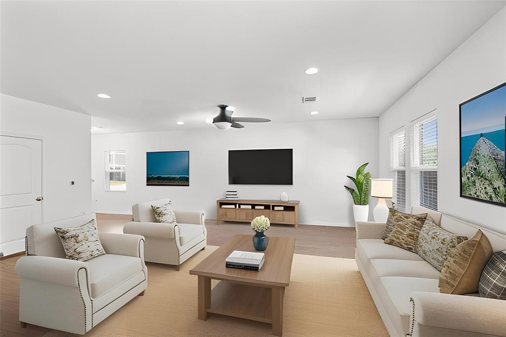 6500 Routenburn Street Austin, TX 78754 - Photo 5 of 38 Living area with wood finished floors, recessed lighting, and a ceiling fan