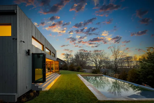a view of a swimming pool with a yard