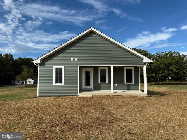 a front view of a house with yard