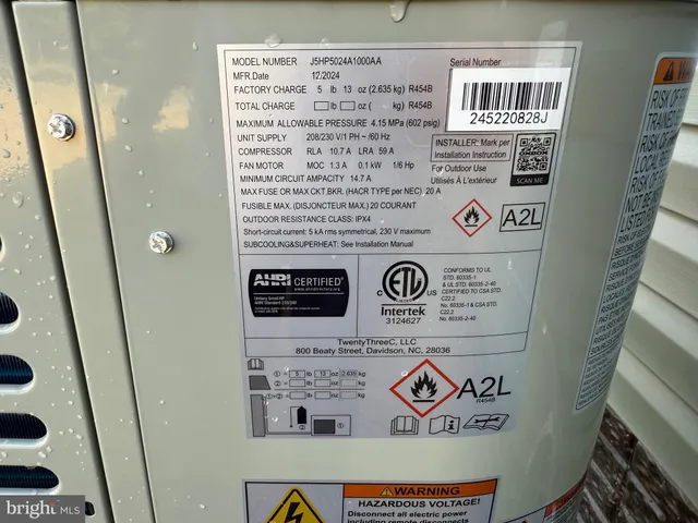 a view of a house with yard and lake view