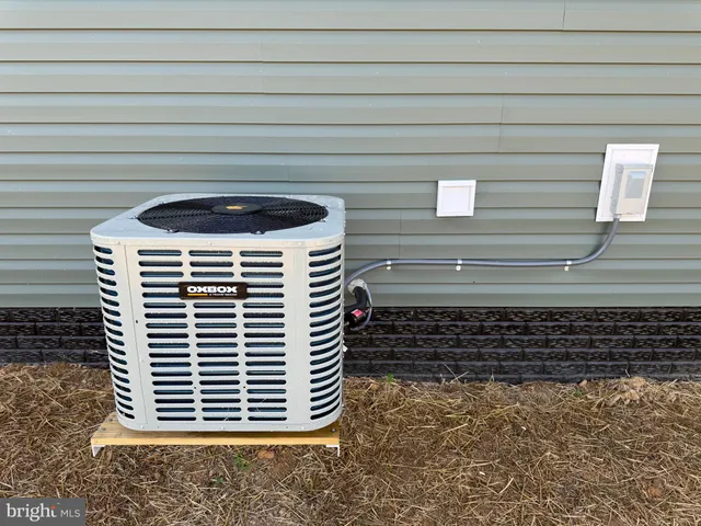 a view of a field with trees in the background