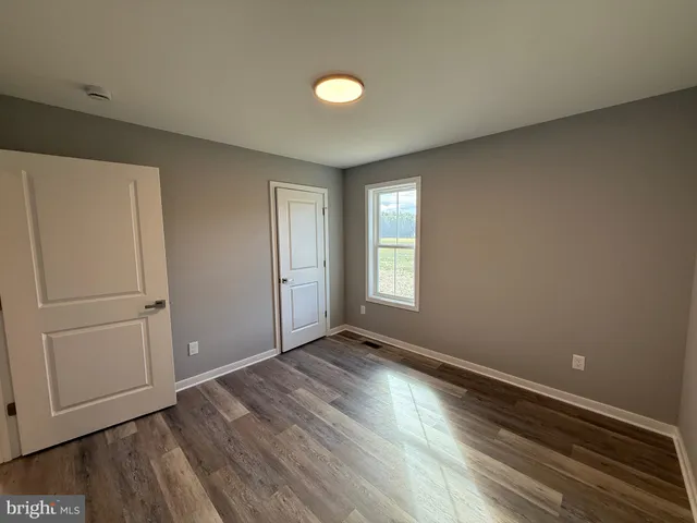 a bathroom with a toilet and a sink