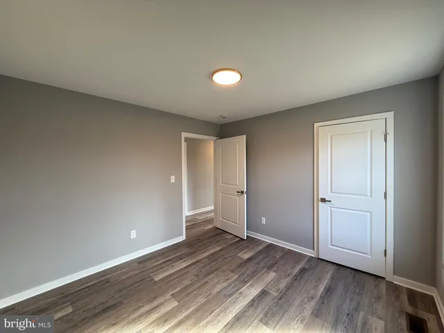 a bathroom with a tub and a toilet