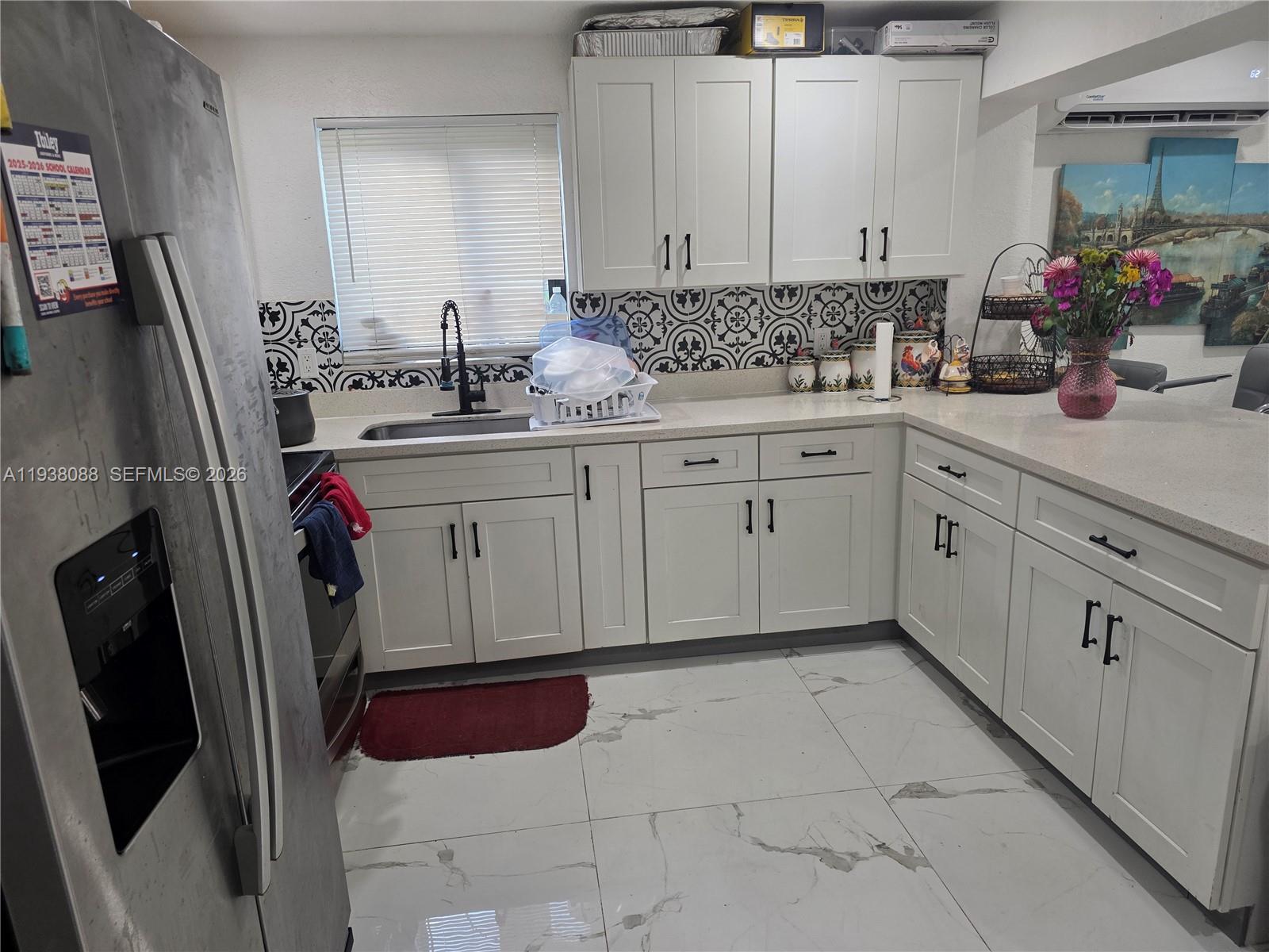1490 Northeast 147th Street Miami, FL 33161 - Photo 5 of 9 a bathroom with a sink and a mirror
