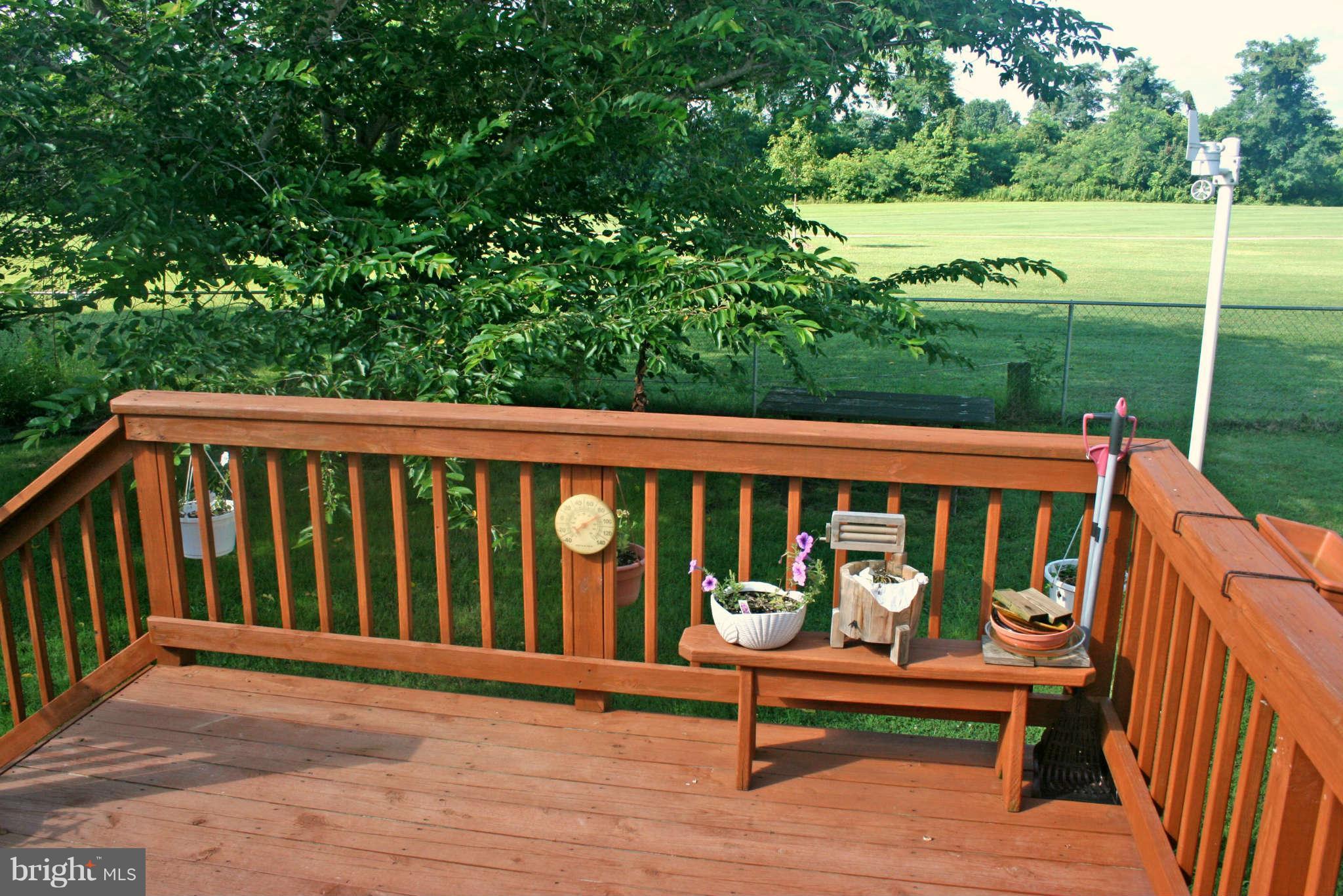 127 Cove Point Road Lusby, MD 20657 - Photo 10 of 27 Deck with fenced yard and large shed