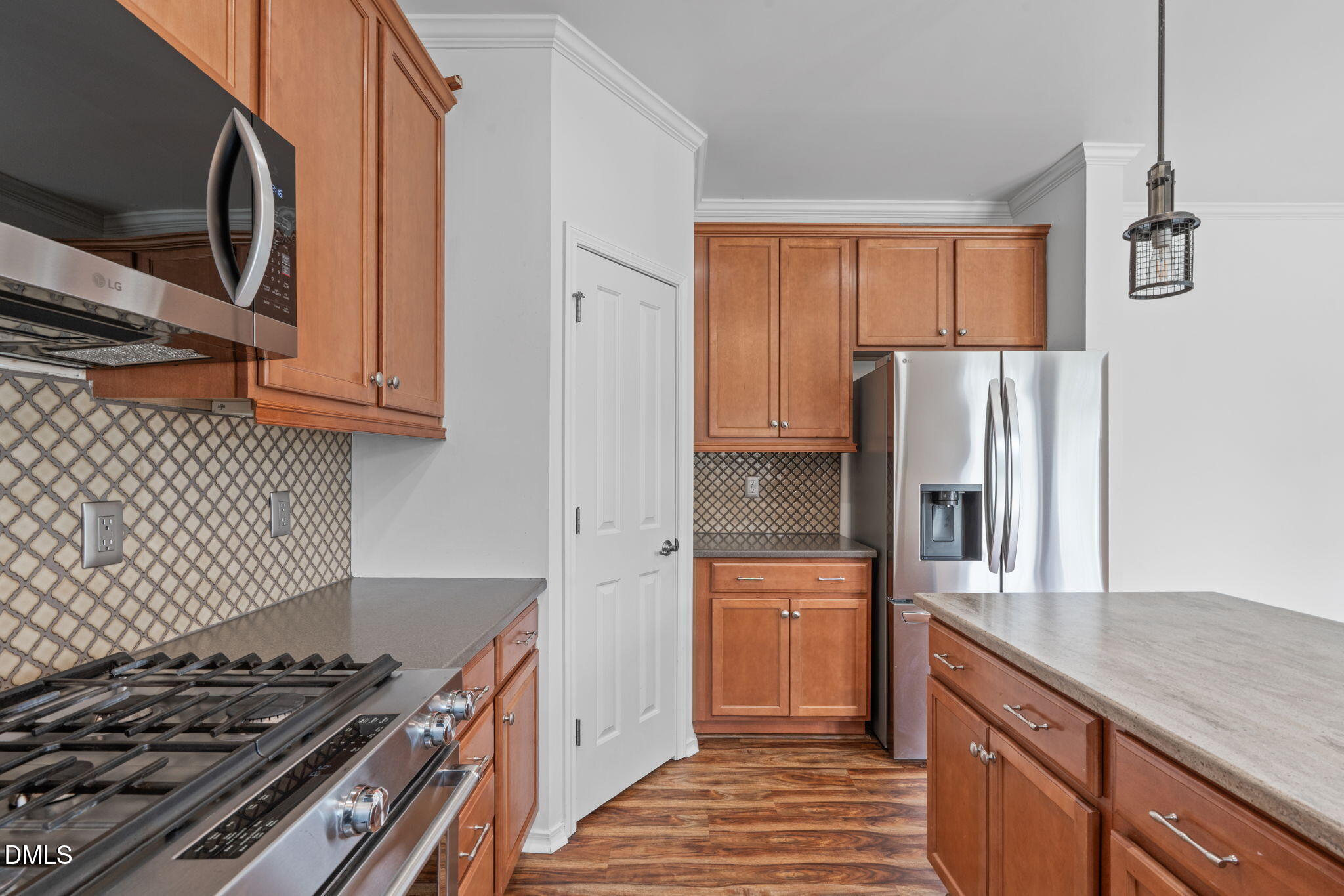 124 Daneborg Road Durham, NC 27703 - Photo 31 of 40 a kitchen with stainless steel appliances granite countertop a refrigerator and a stove top oven
