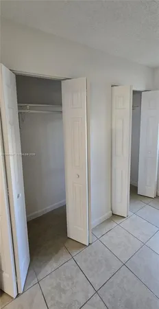 a kitchen with a sink a stove and refrigerator
