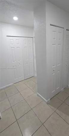 a view of cabinets and wooden floor