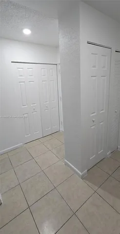 a view of kitchen with granite countertop cabinets and sink