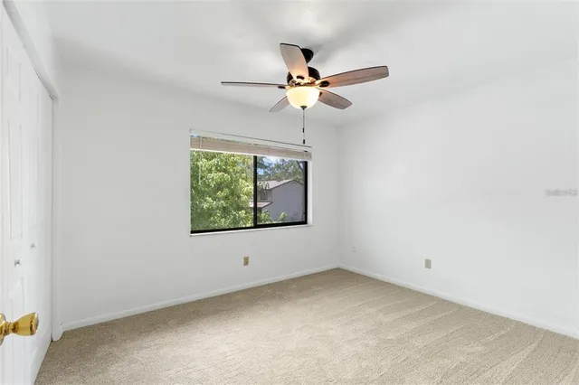 a view of a kitchen with a sink and a refrigerator