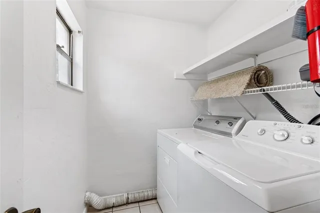 a view of a house with swimming pool and sitting area
