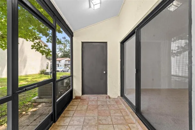 a view of a glass door and an outdoor space