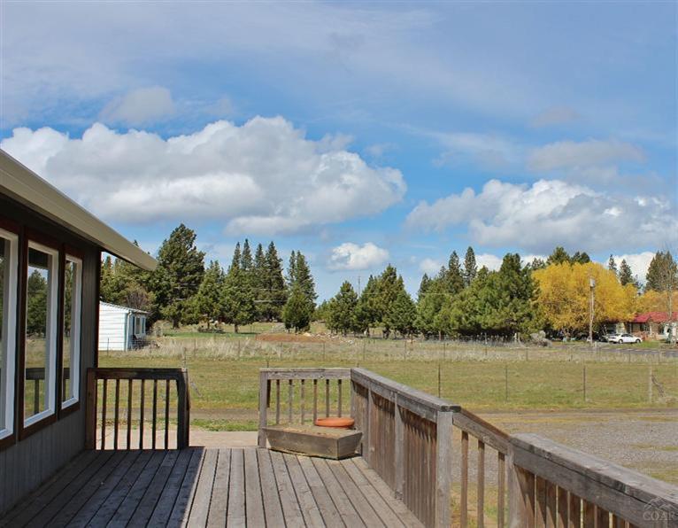 19221 Shoshone Road Bend, OR 97702 - Photo 7 of 15 a view of a lake with wooden floor and city view