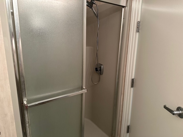 21839 Riviera Court, Unit G Mundelein, IL 60060 - Photo 8 of 17 a bathroom with a glass shower door