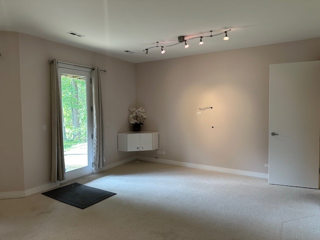 21839 Riviera Court, Unit G Mundelein, IL 60060 - Photo 10 of 17 a view of a room that has a window and a kitchen area