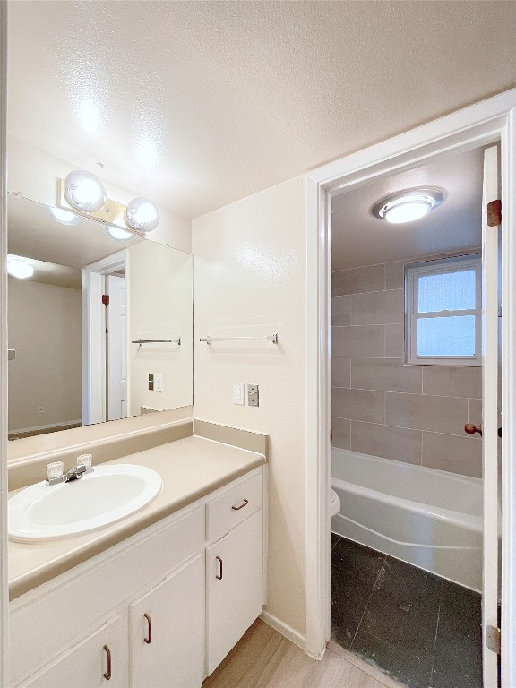 3400 Speedway, Unit 105 Austin, TX 78705 - Photo 11 of 18 a bathroom with a shower sink and mirror