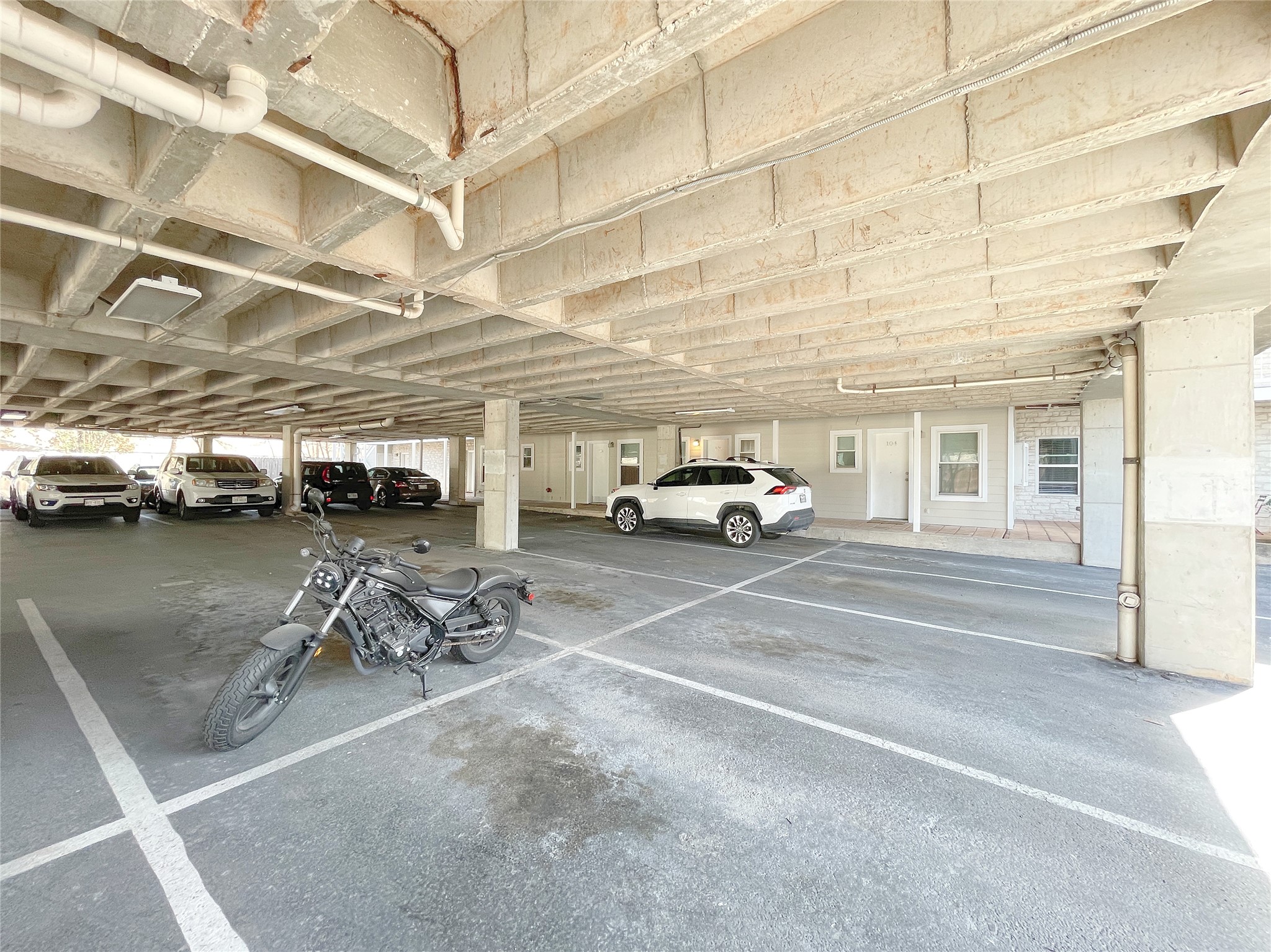 3400 Speedway, Unit 105 Austin, TX 78705 - Photo 17 of 18 a view of parking with cars parked